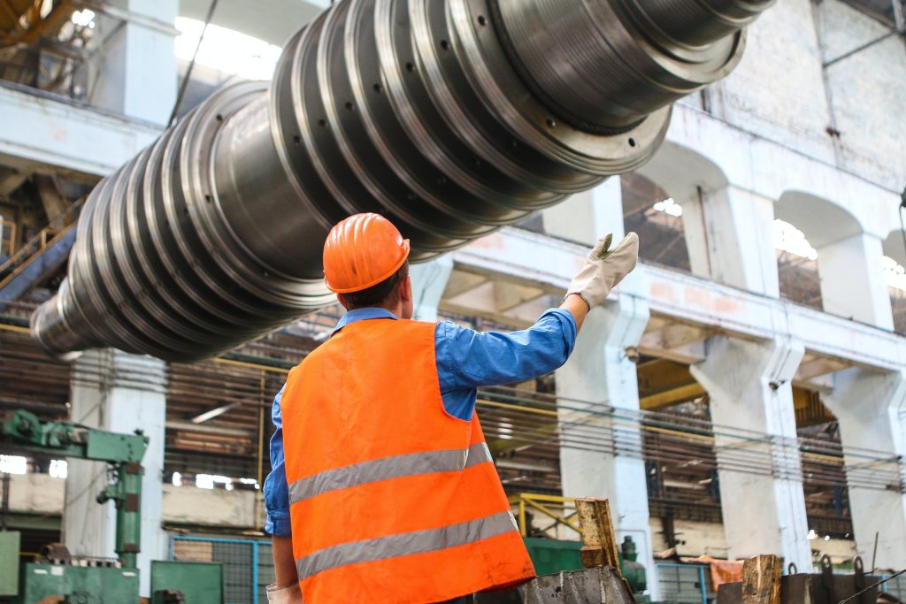 A workman in a loud environment without hearing protection